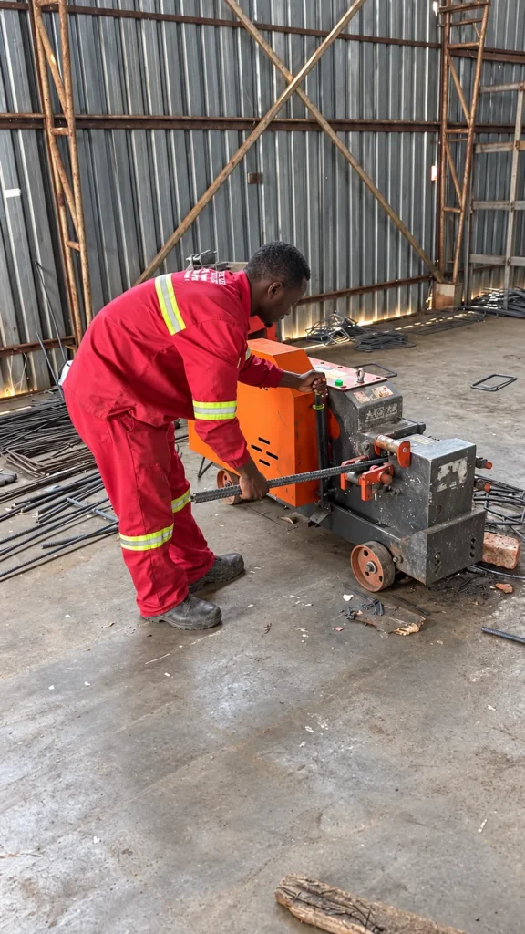 Steel Total worker preparing reinforcement steel using workshop machinery