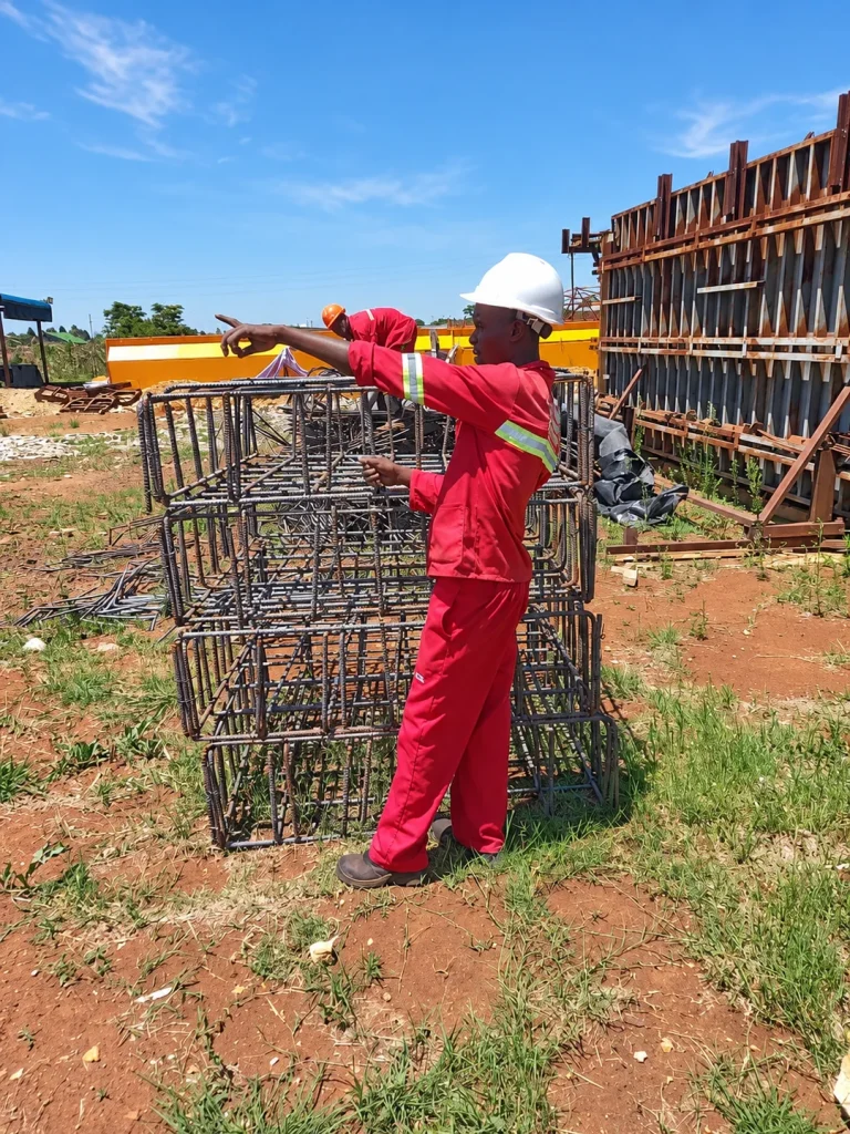 Steel Total worker beside assembled reinforcement cages